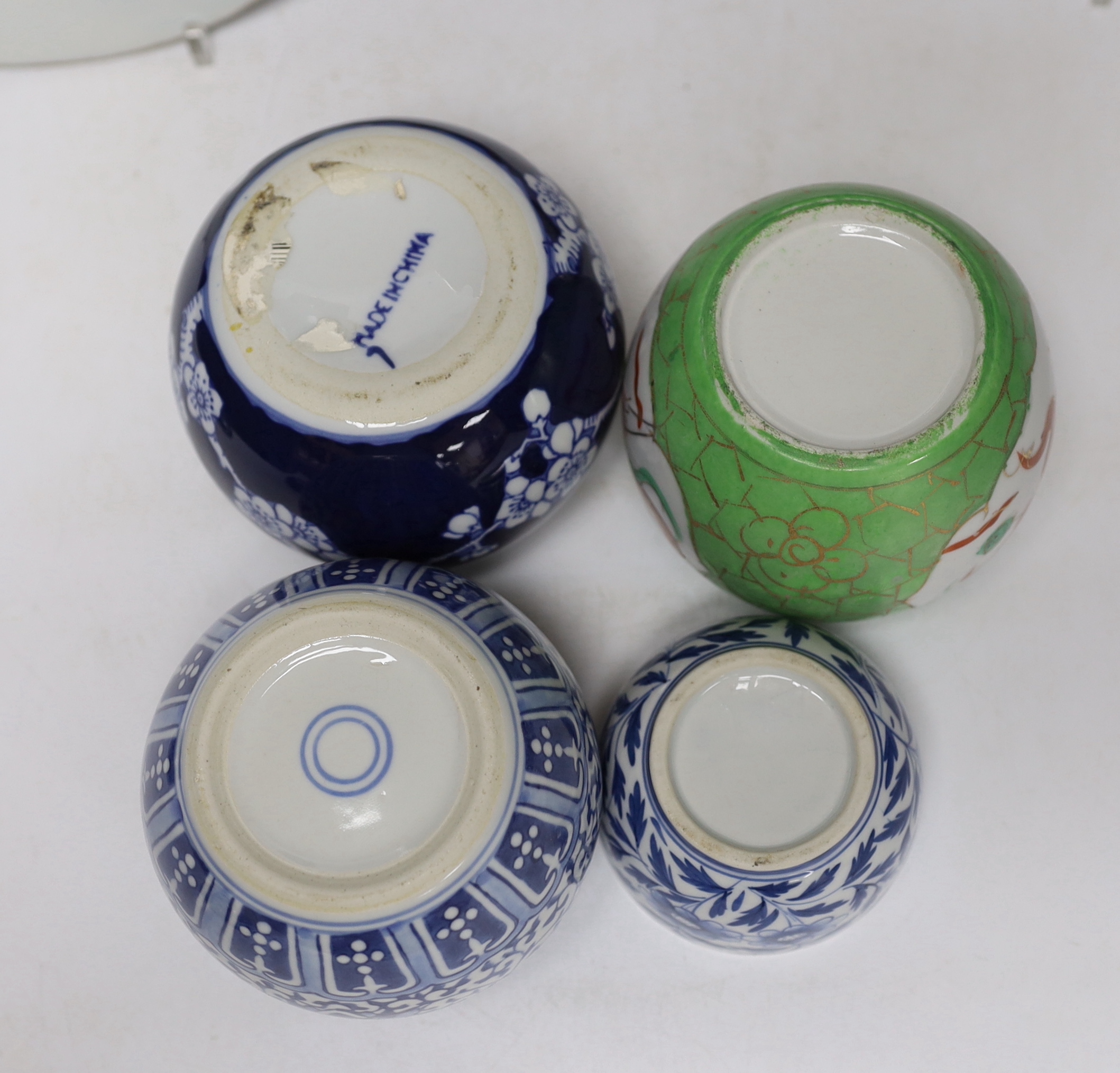 A group of Japanese and Chinese porcelain including an 18th century Chinese export dish, tallest 36cm